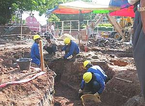 Image: Museums Department workers removing soil yesterday to find out if the wall was one of the bastions built by the Portuguese."