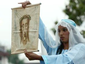 Picture: Female presence: Rachel Thomas, playing the role of Veronica, displaying the facial imprint of Christ to the procession crowd"