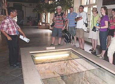 Image: Docent Shaukani Abbas explaining the history of the Malacca tunnel."
