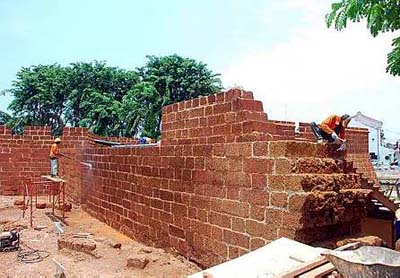 Image: Hard grind: Workers in the final stage of restoring Middleburg Bastion and the fort's massive walls."