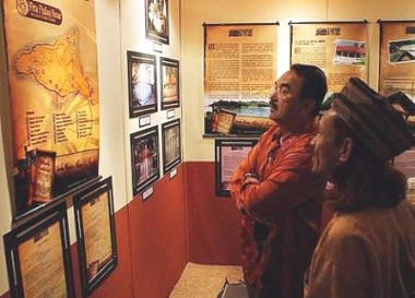Image: Unique: Ana Faqir (right) relating stories to Mohd Ali (left) at the launch of the History and Mystery of Pulau Besar exhibition on Sunday."