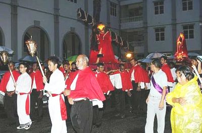 Image: The statue of Christ carrying the cross being paraded around the church compound."