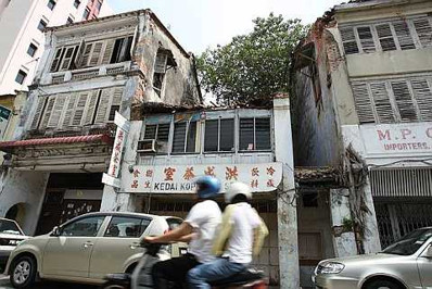 Image: Run-down shophouses on Lebuh Cina stick out like sore thumbs."