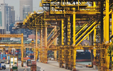 Image: Cranes at Singapore Dock stand idle, waiting for work."